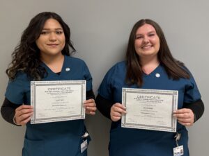 two WCC Students holding their certificates